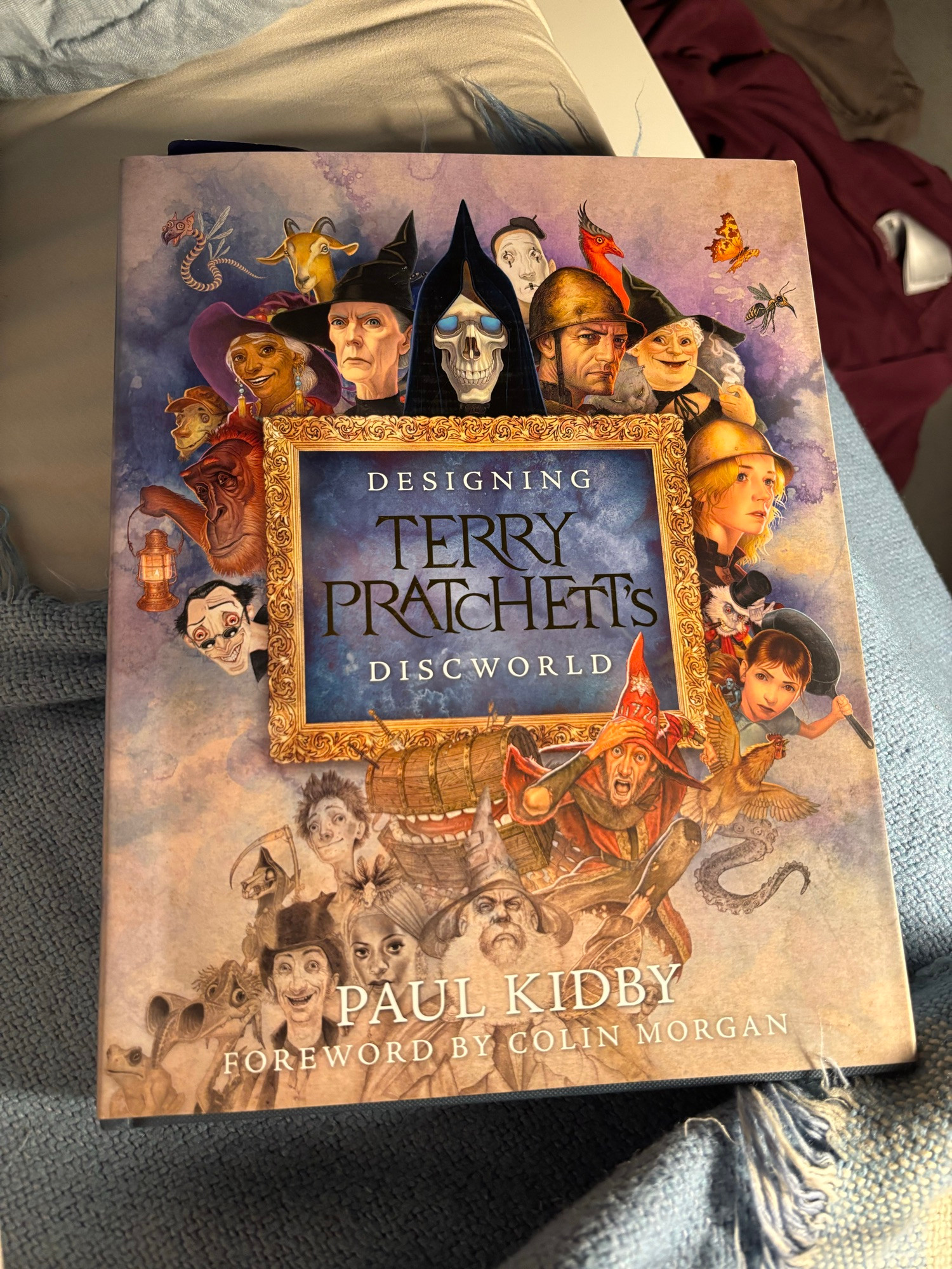 A picture of the book's cover on my bed.